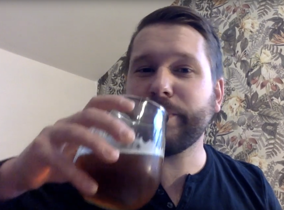 Andy Verboom taking a drink, from his reading for KFB's spring 2020 online release party